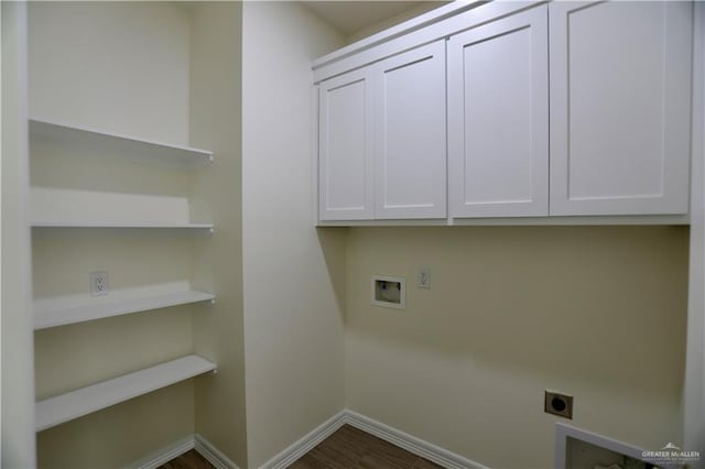 laundry area featuring electric dryer hookup, hookup for a washing machine, and cabinets