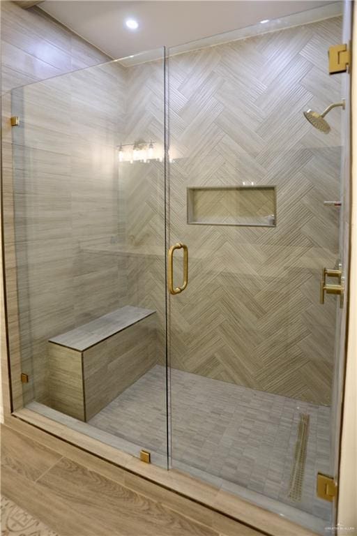 bathroom featuring an enclosed shower