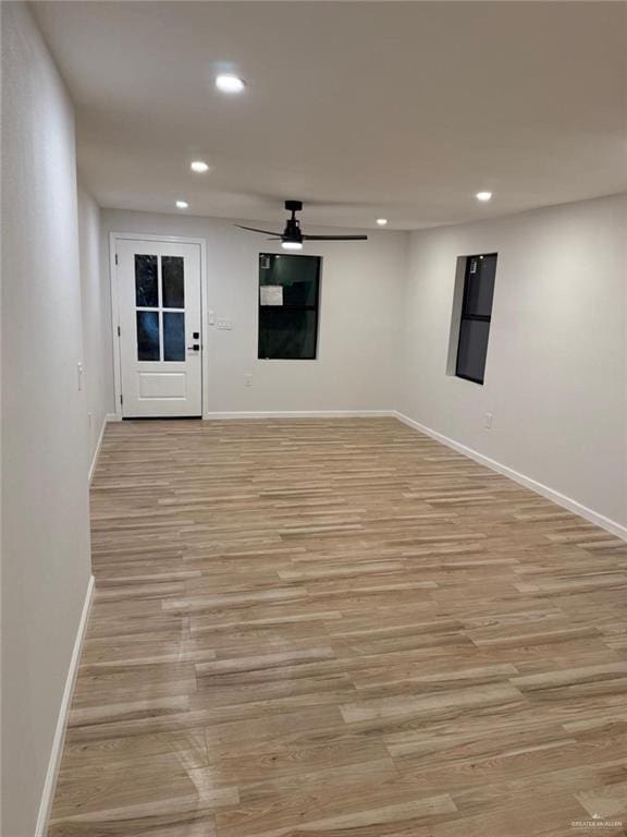 spare room with light wood-style floors, recessed lighting, ceiling fan, and baseboards