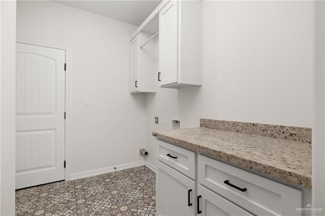 clothes washing area with cabinets, washer hookup, and electric dryer hookup