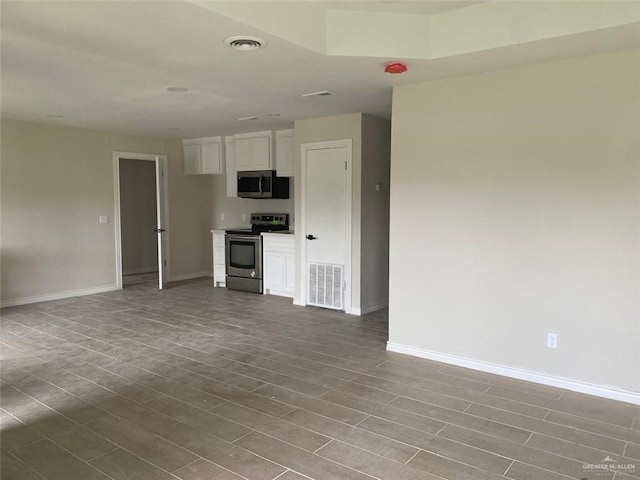 unfurnished living room with hardwood / wood-style floors