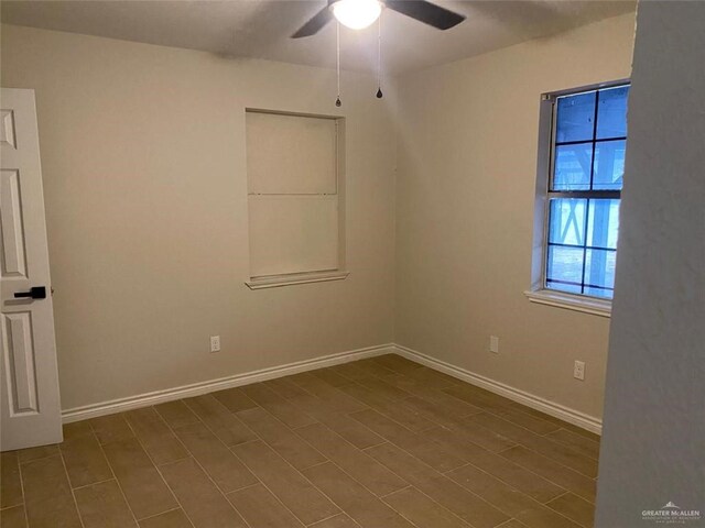 unfurnished room featuring hardwood / wood-style flooring and ceiling fan