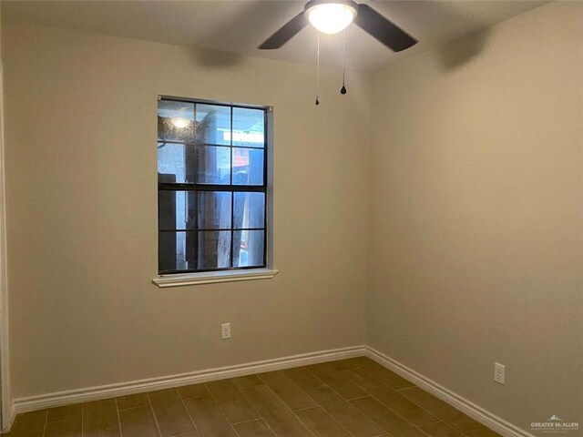 empty room featuring ceiling fan and wood-type flooring