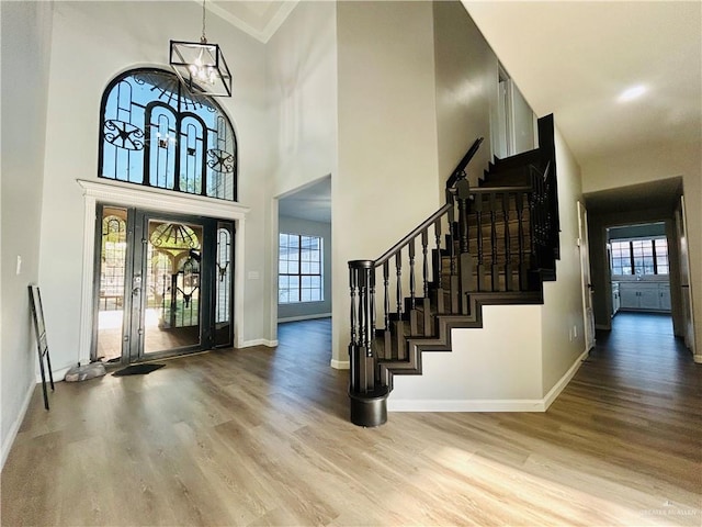 915 Durango St, Mission, TX 78572 - entryway featuring wood finished floors, a notable chandelier, plenty of natural light, and stairs