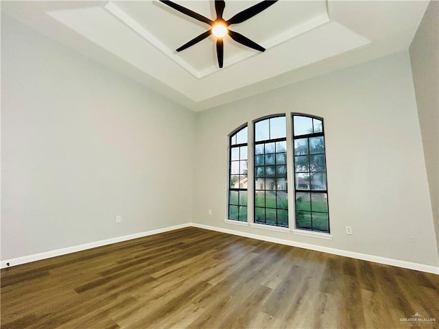 915 Durango St, Mission, TX 78572 - spare room featuring a raised ceiling, wood finished floors, ceiling fan, and baseboards