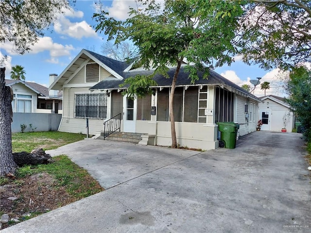 view of front facade with a shed