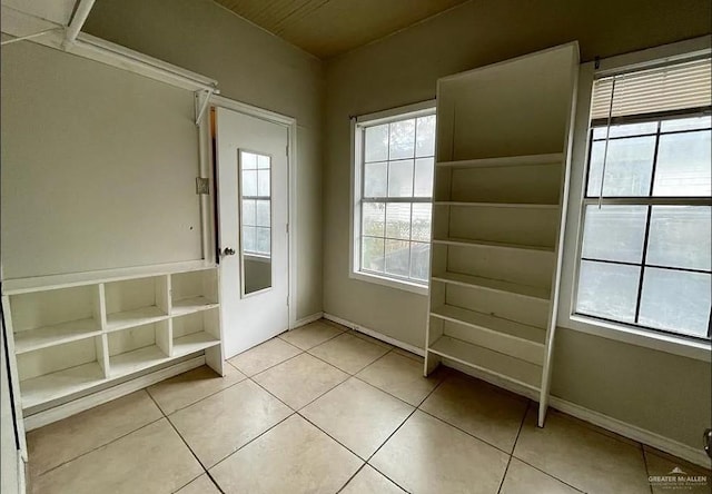 doorway to outside featuring light tile patterned flooring