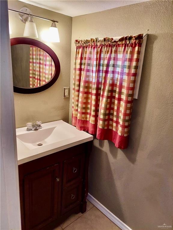 bathroom with vanity and tile patterned floors