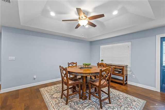 23807 Stuart Place Rd, Harlingen, TX 78552 - dining space with a tray ceiling, ceiling fan, recessed lighting, and wood finished floors