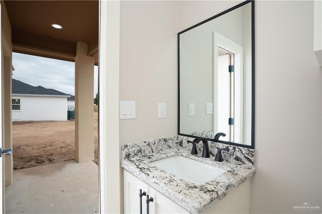 bathroom featuring recessed lighting, unfinished concrete flooring, and vanity