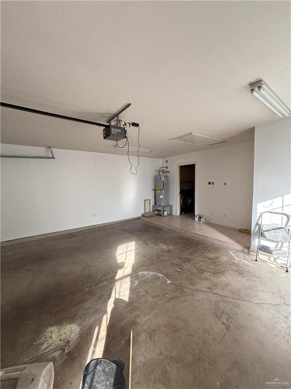 garage featuring a garage door opener and water heater