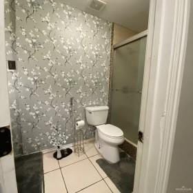 4907 N 25th Ln, Mcallen, TX 78504 - full bath featuring toilet, baseboards, tile patterned flooring, and a stall shower