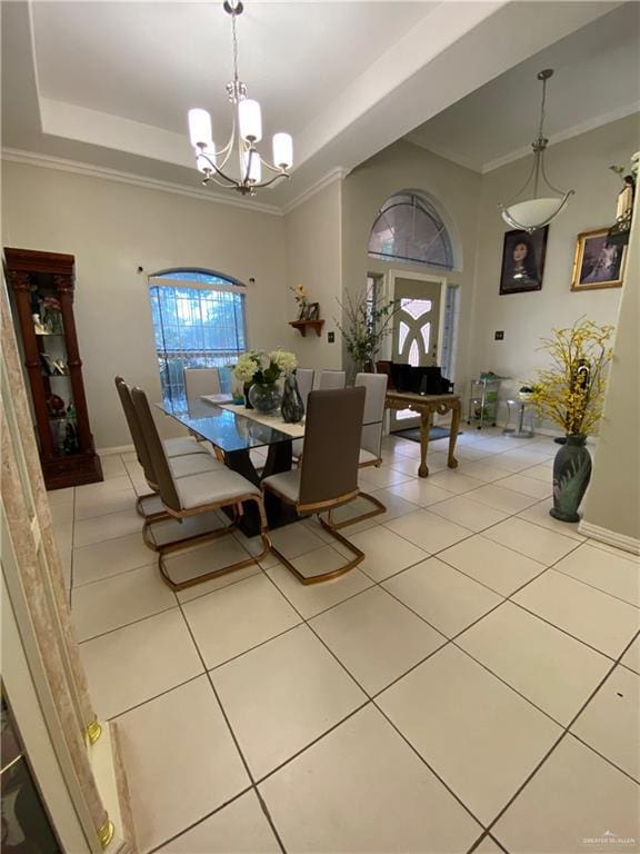 4907 N 25th Ln, Mcallen, TX 78504 - dining area featuring a tray ceiling, baseboards, light tile patterned floors, and an inviting chandelier