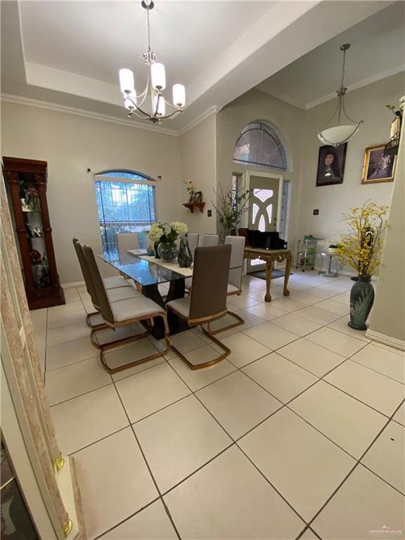 4907 N 25th Ln, Mcallen, TX 78504 - dining room with baseboards, a tray ceiling, a chandelier, and light tile patterned flooring