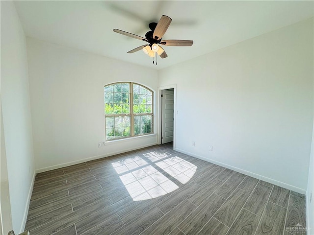 606 S Paseo Del Rey St, Mission, TX 78572 - spare room with wood tiled floors, baseboards, and a ceiling fan