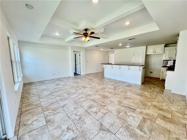 606 S Paseo Del Rey St, Mission, TX 78572 - unfurnished living room featuring coffered ceiling, ceiling fan, recessed lighting, baseboards, and beamed ceiling