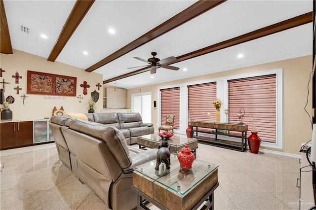 living area featuring beam ceiling, ceiling fan, recessed lighting, dark aggregate flooring, and baseboards