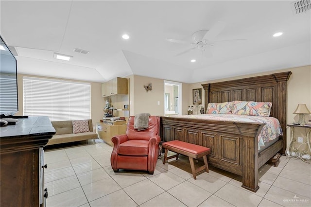bedroom with light tile patterned floors, ceiling fan, recessed lighting, and ensuite bath