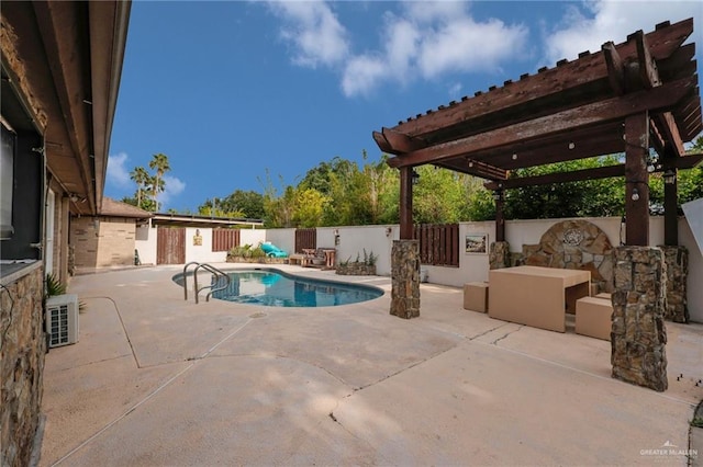 view of pool with a pergola, a patio area, and a fenced backyard