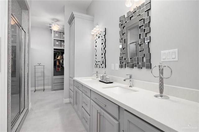 bathroom featuring tile patterned flooring, vanity, walk in shower, and ceiling fan