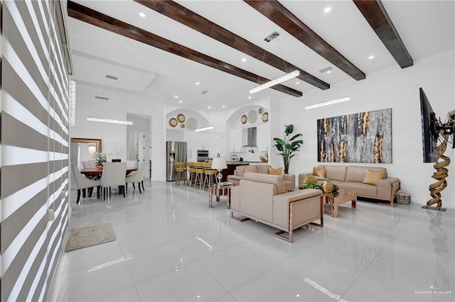3408 Madison Ave, Edinburg, TX 78539 - living area featuring beamed ceiling, light tile patterned floors, a high ceiling, and recessed lighting