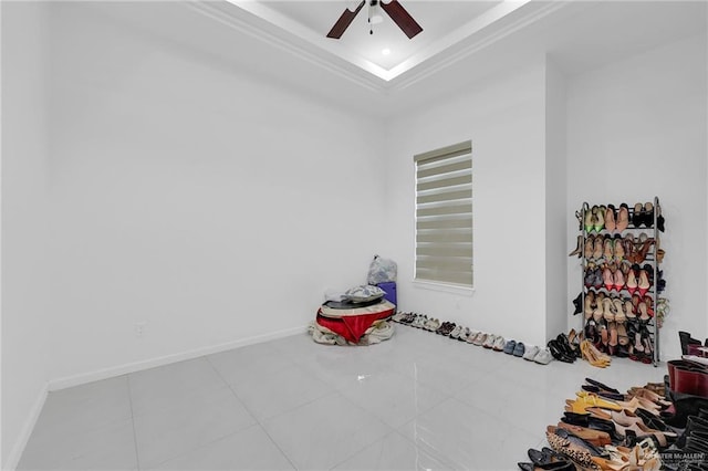 3408 Madison Ave, Edinburg, TX 78539 - tiled empty room featuring ceiling fan and a tray ceiling