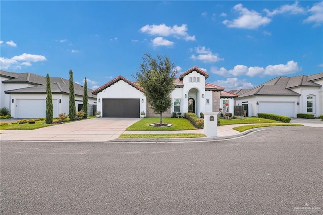3408 Madison Ave, Edinburg, TX 78539 - view of front of house featuring concrete driveway, an attached garage, stucco siding, a tile roof, and a residential view