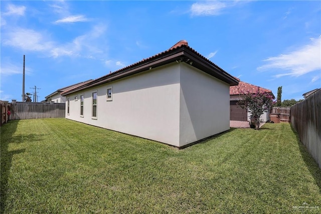 3408 Madison Ave, Edinburg, TX 78539 - back of property with stucco siding, a fenced backyard, and a tiled roof