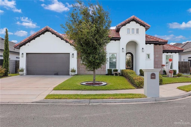 3408 Madison Ave, Edinburg, TX 78539 - mediterranean / spanish-style home featuring a tiled roof, a garage, stucco siding, and driveway