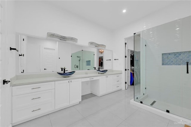 3408 Madison Ave, Edinburg, TX 78539 - bathroom with vanity, a shower stall, tile patterned flooring, and recessed lighting