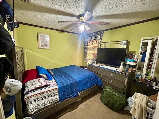 carpeted bedroom featuring ceiling fan, crown molding, and a textured ceiling