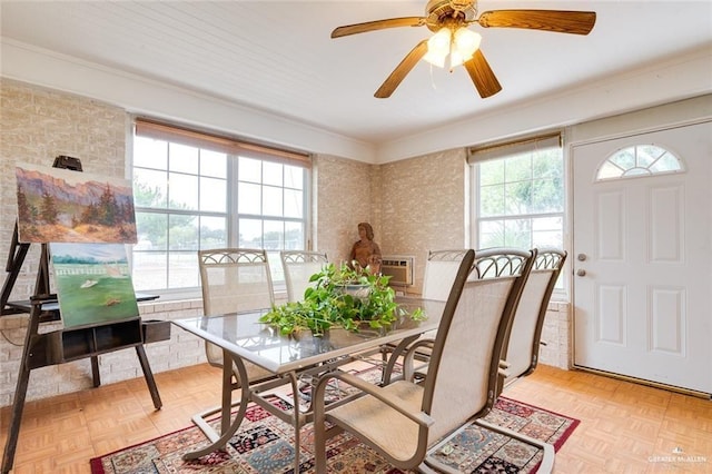 dining room with light parquet floors and ornamental molding