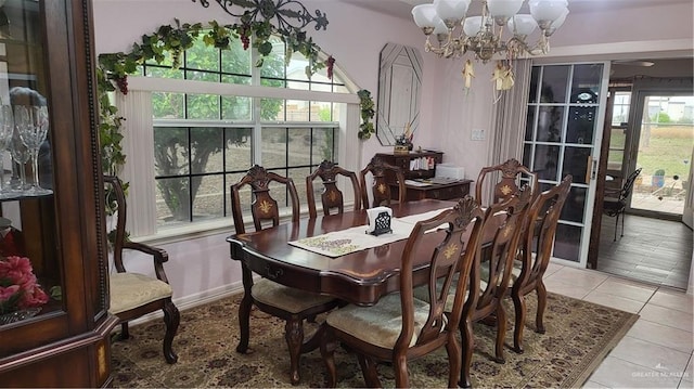 tiled dining space with a notable chandelier