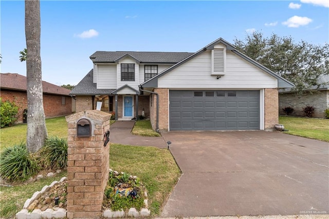 traditional-style home featuring a front yard, concrete driveway, brick siding, and an attached garage