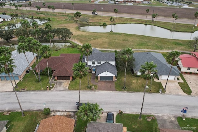 birds eye view of property with a residential view and a water view