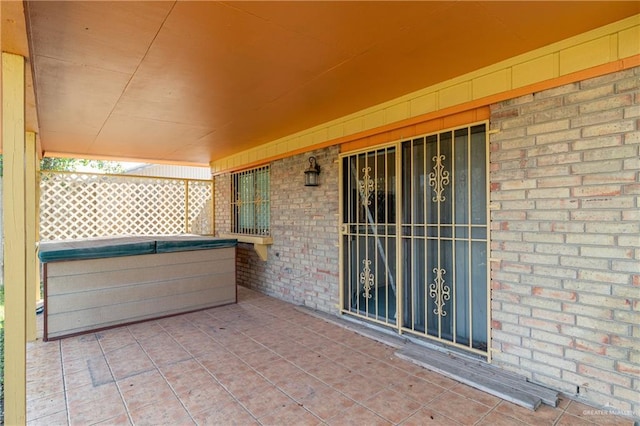 view of patio featuring a hot tub