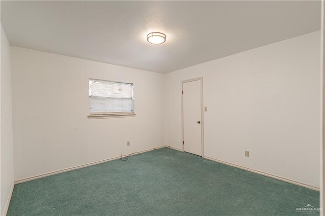 spare room featuring carpet floors