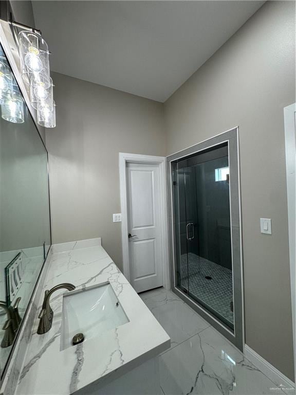 bathroom with walk in shower and vanity