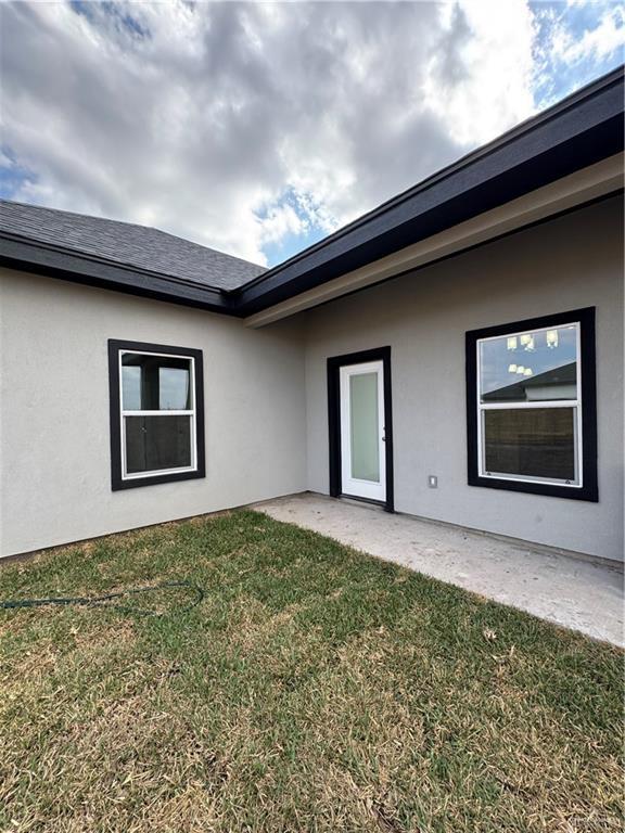 exterior space with a yard and a patio