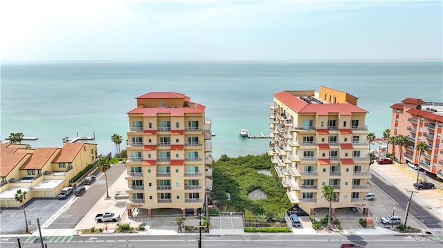 birds eye view of property with a water view