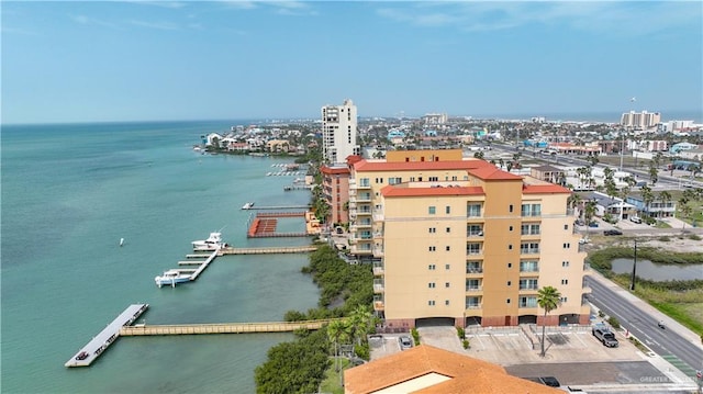 bird's eye view featuring a water view and a city view