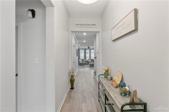 corridor with crown molding and light wood-type flooring