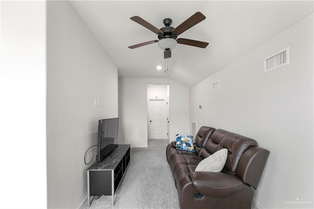 living room with ceiling fan, light colored carpet, and lofted ceiling