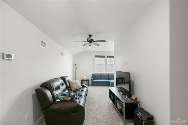 carpeted living room featuring ceiling fan and lofted ceiling