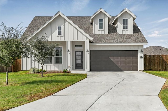 view of front facade with a garage and a front lawn