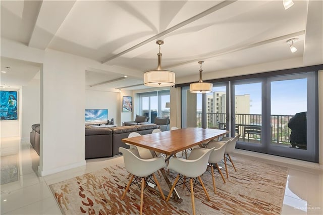 6300 Padre Blvd Unit 901, South Padre Island, TX 78597 - dining room featuring light tile patterned floors and beam ceiling