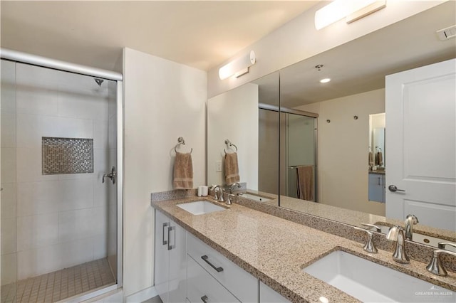 6300 Padre Blvd Unit 901, South Padre Island, TX 78597 - bathroom featuring a stall shower and double vanity