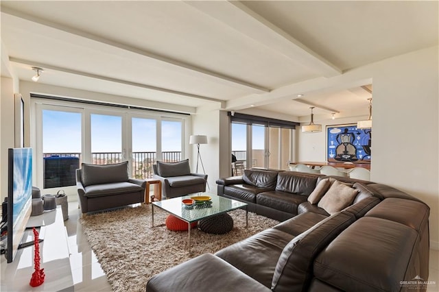 6300 Padre Blvd Unit 901, South Padre Island, TX 78597 - living room featuring beam ceiling and healthy amount of natural light