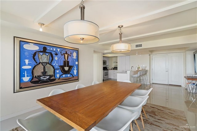 dining room featuring light tile patterned flooring