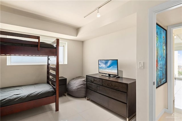 6300 Padre Blvd Unit 901, South Padre Island, TX 78597 - bedroom featuring track lighting, multiple windows, and light tile patterned floors